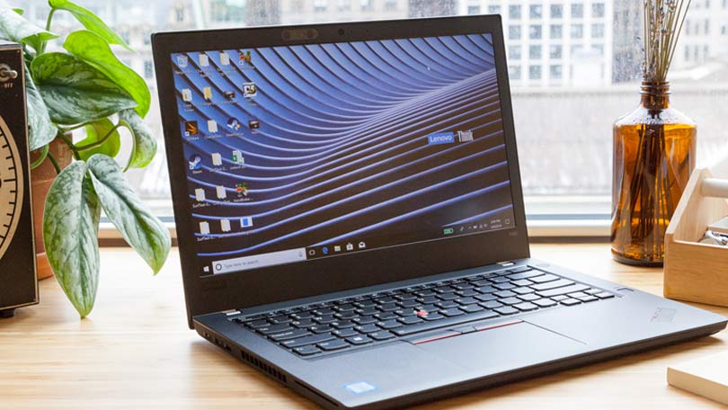 lenovo t480 refurbished laptop sitting on a desk on wrking desk