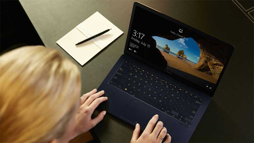 women working on refurbished zenbook laptop